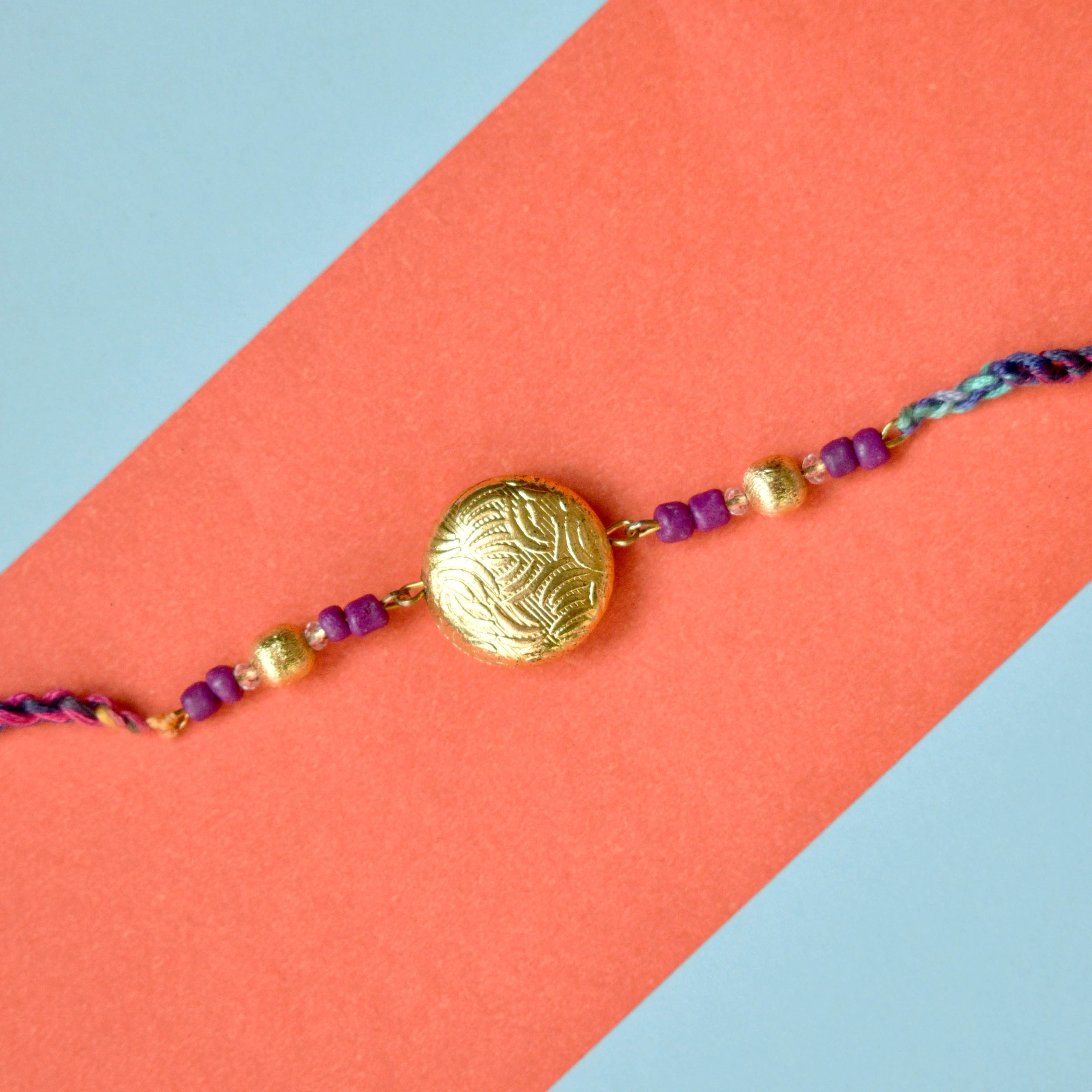 Golden crescent rakhi with Roli Chawal